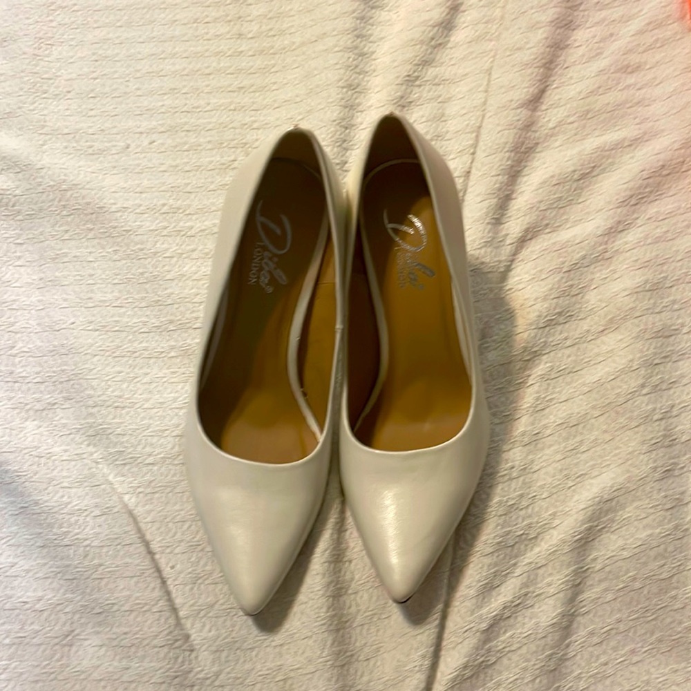 Never been used white pumps